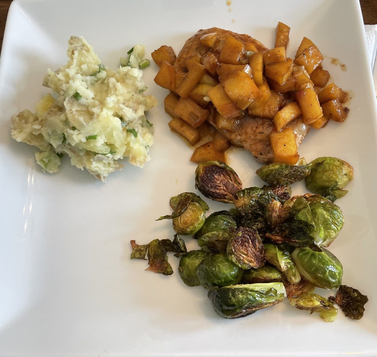 Brown Sugar Bourbon Pork Chops with Apple Pan Sauce, Scallion Mashed Potatoes and Brussel Sprouts